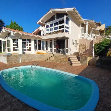 Casa com 3 dormitórios, home office, salão de festas e piscina localizada no Jardim América